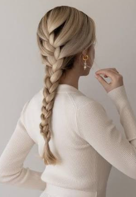 Winter Hair Braid Ideas: 20 Styles to Try featuring a cozy chunky Dutch braid with a winter sweater
Romantic half-up braided hairstyle with soft waves for winter
Elegant braided low bun with a velvet ribbon for a winter occasion
Double French braids styled with a cozy winter hat and scarf